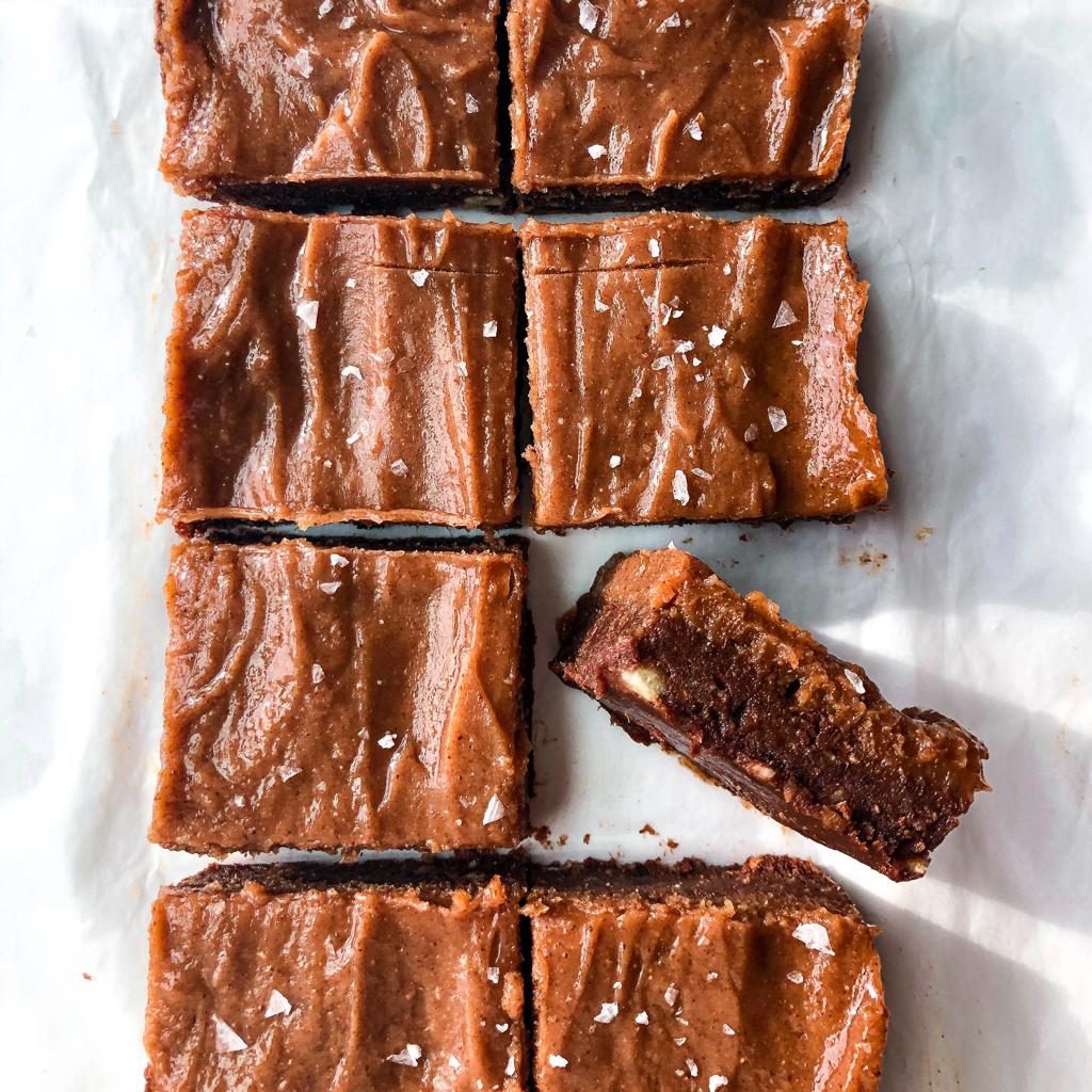 Salted caramel brownies on table cut into squares